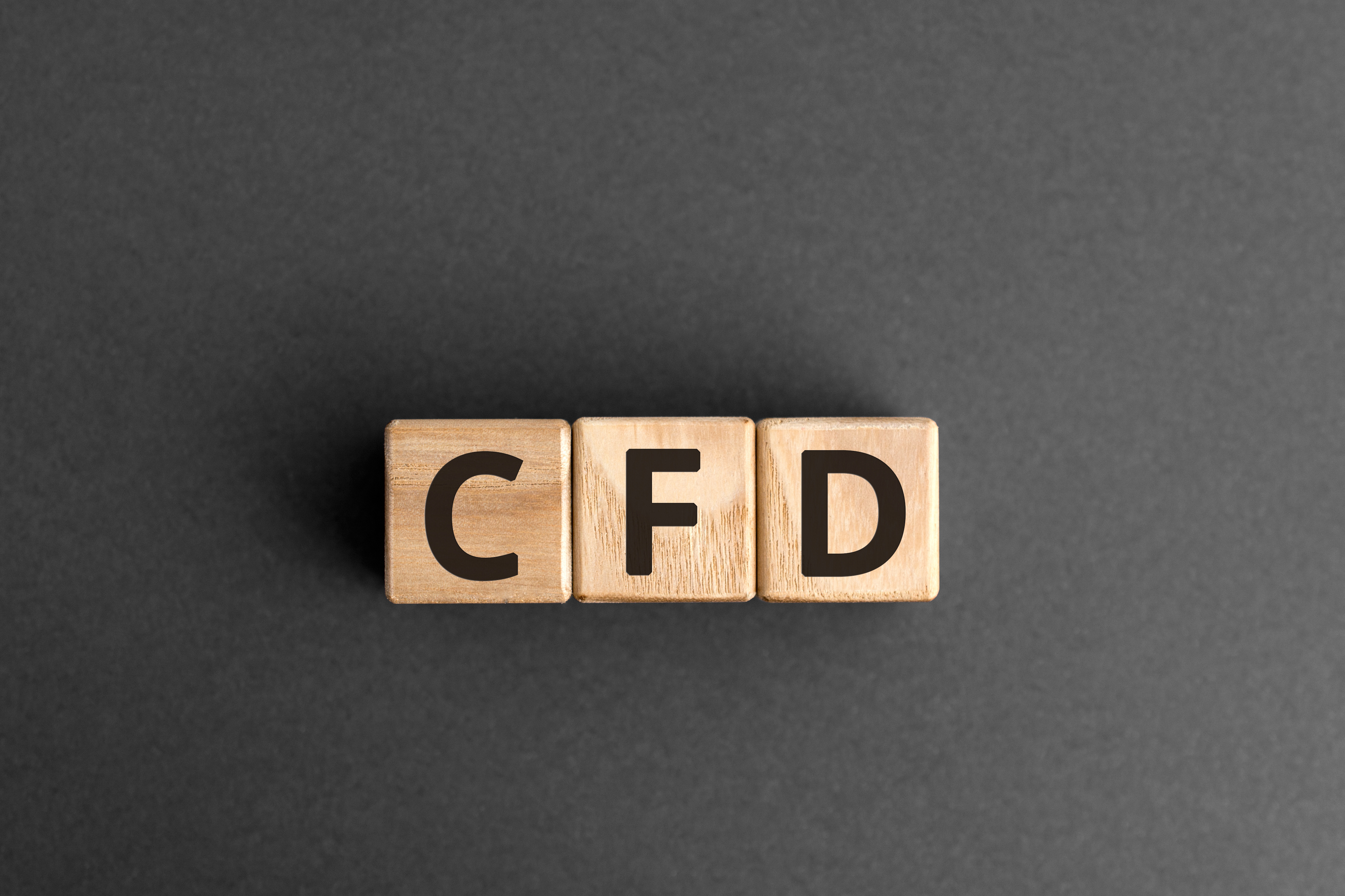 CFD   acronym from wooden blocks with letters, Contract For Diff